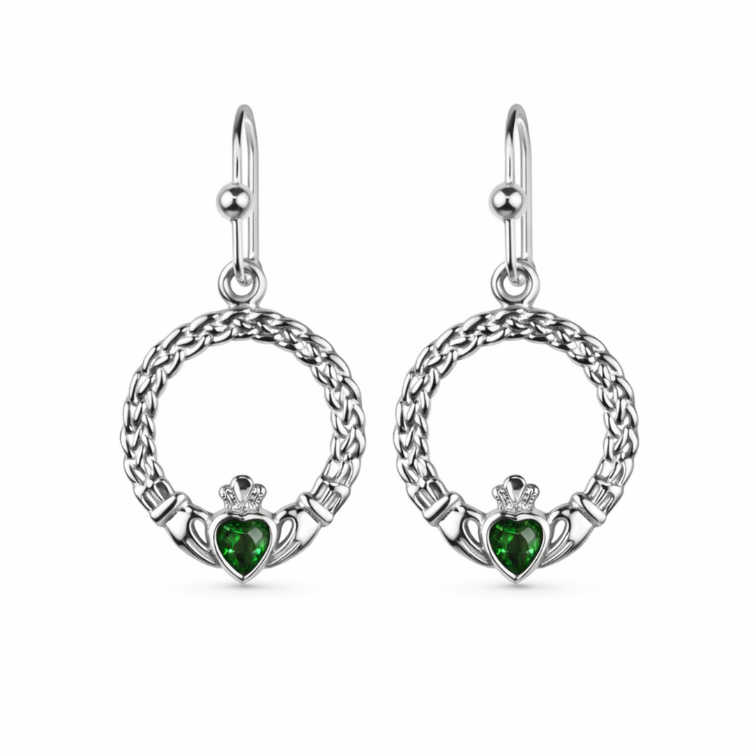 Pair of silver earrings with green gemstones on a white background