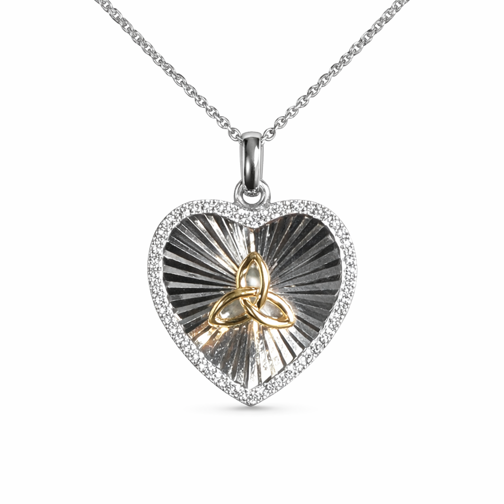 Heart-shaped pendant with Trinity Knot design on a white background