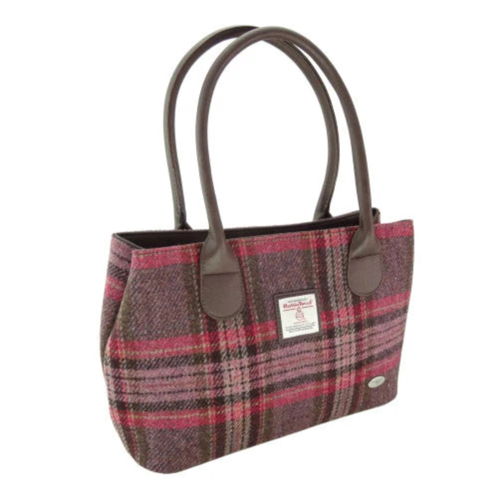 Plaid handbag with brown handles on a white background