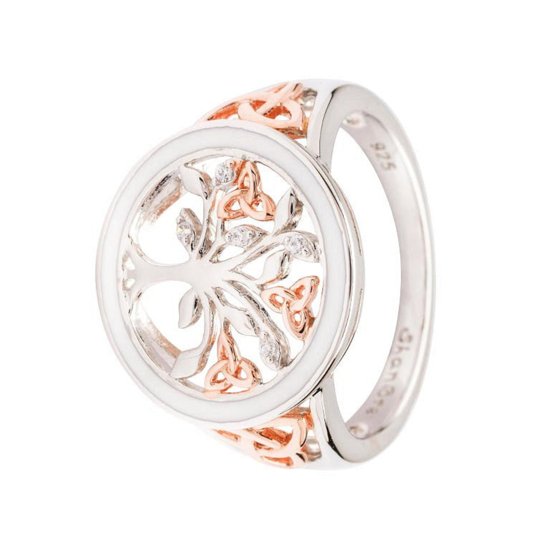 Silver and rose gold ring with intricate design on a white background
