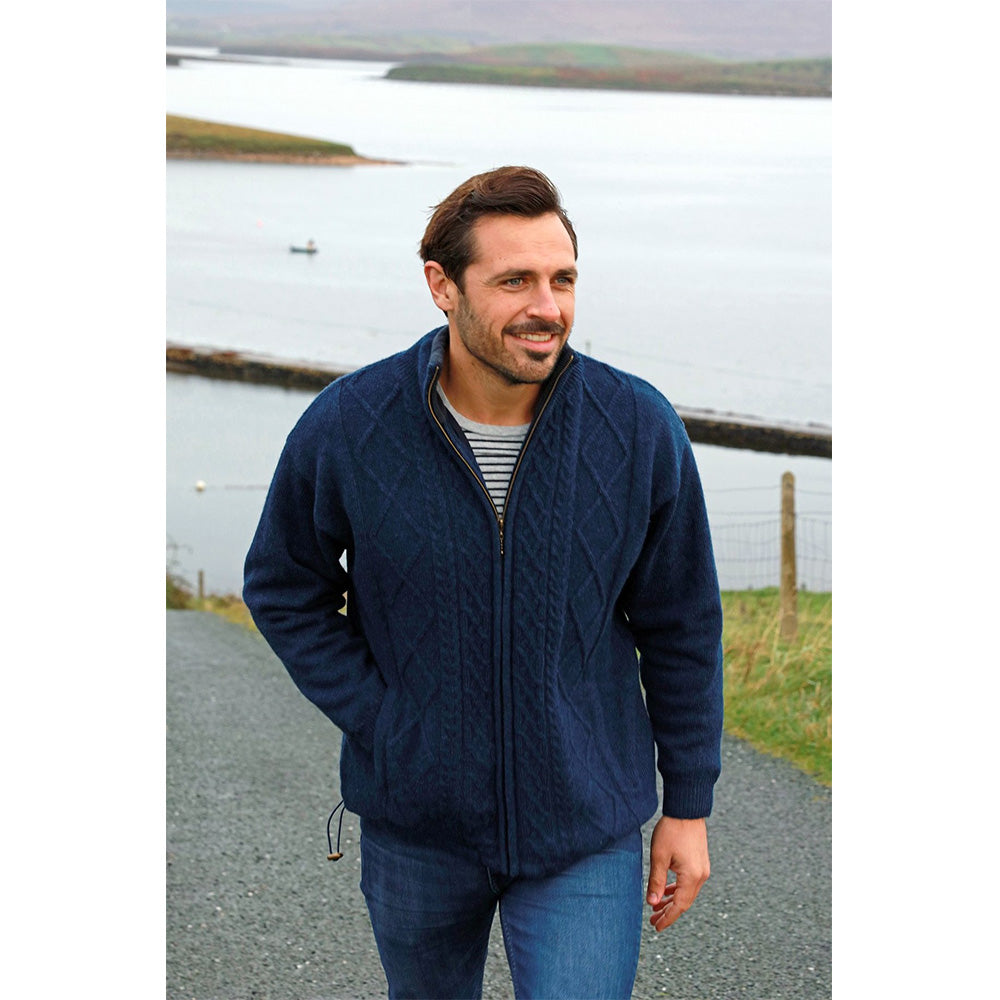 male model of navy full zip merino wool sweater jacket by aran woollen mills