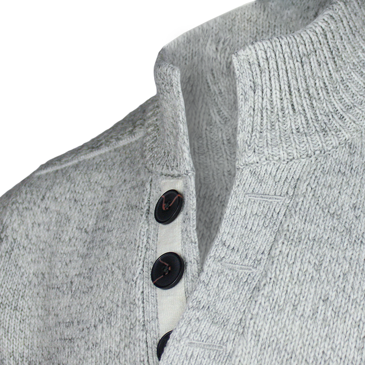 buttons close up of emerald isle winter white galway shawl collar sweater